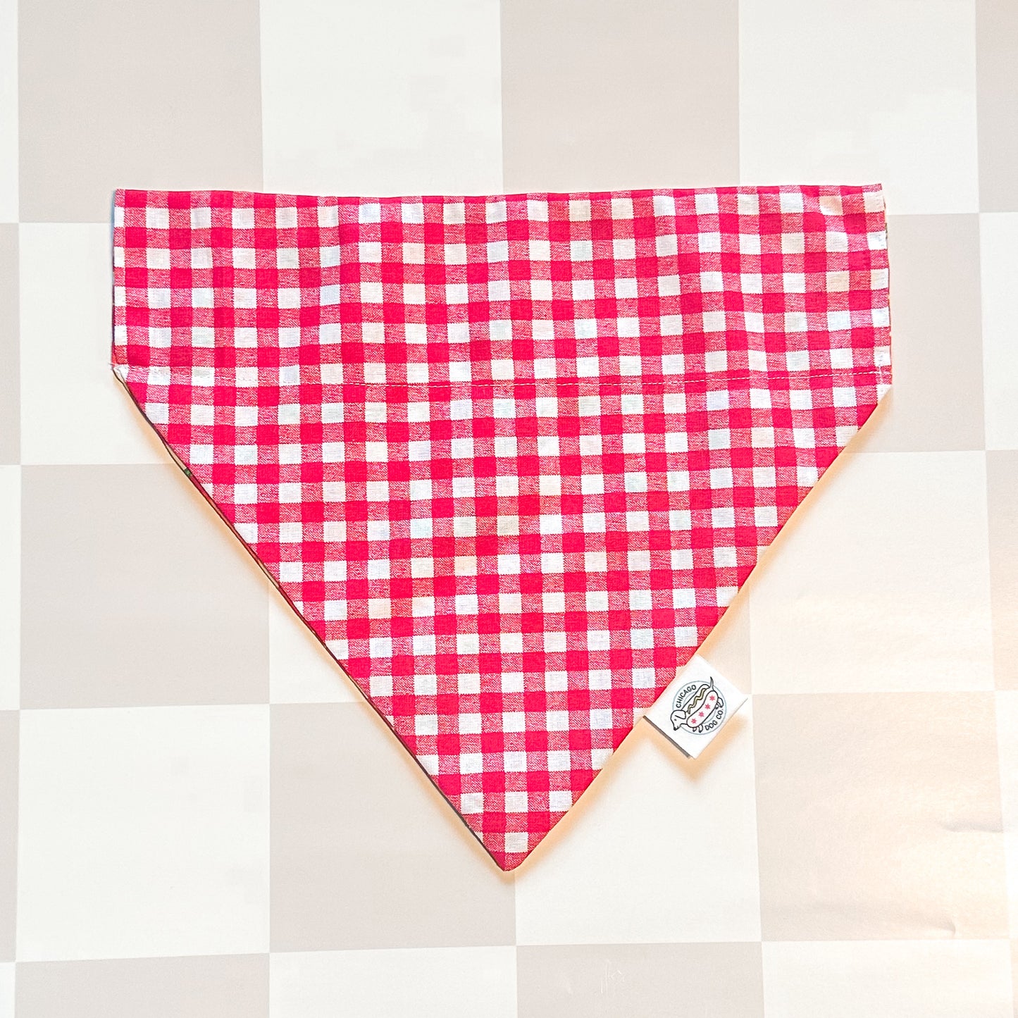 Red and white checkered bandana on a neutral background
