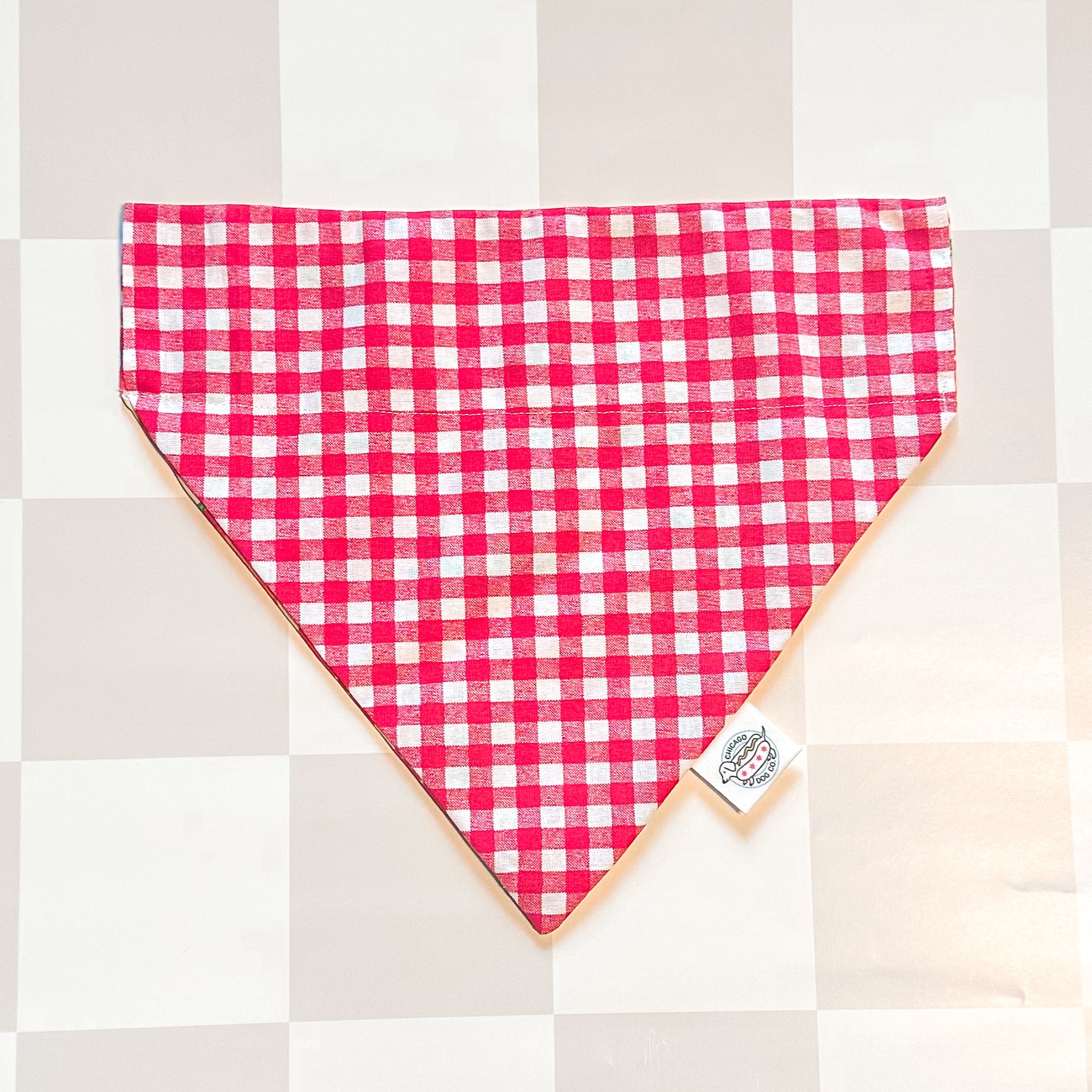 Red and white checkered bandana on a neutral background
