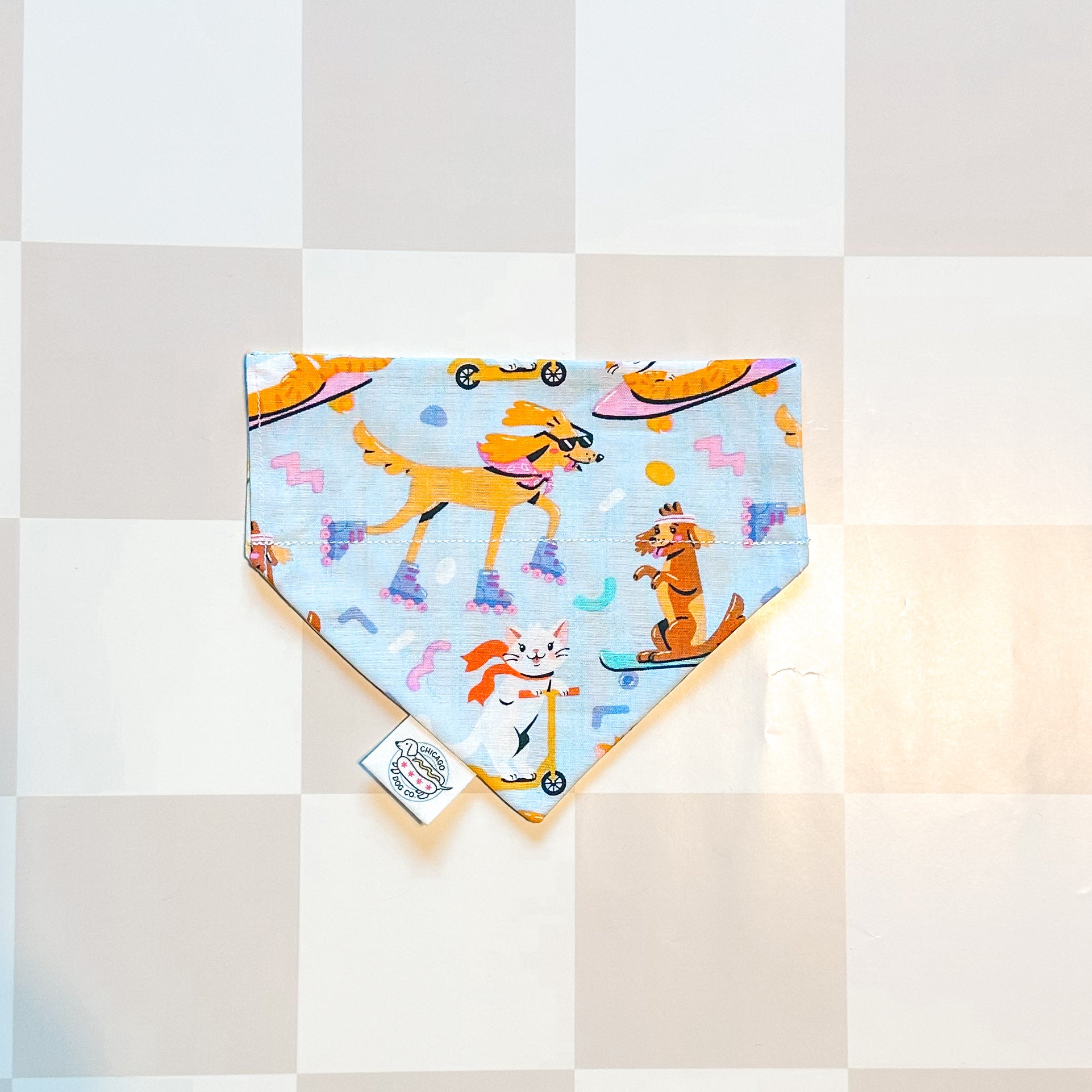 Dog bandana with cartoon dog design on a checkered background