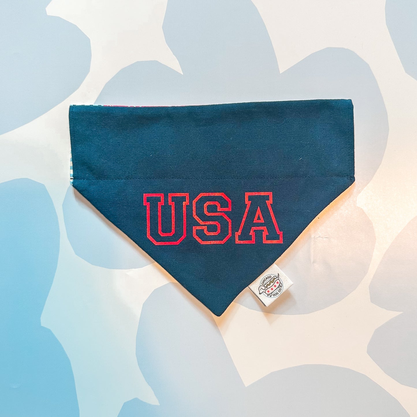 Navy blue bandana with 'USA' in red on a light background