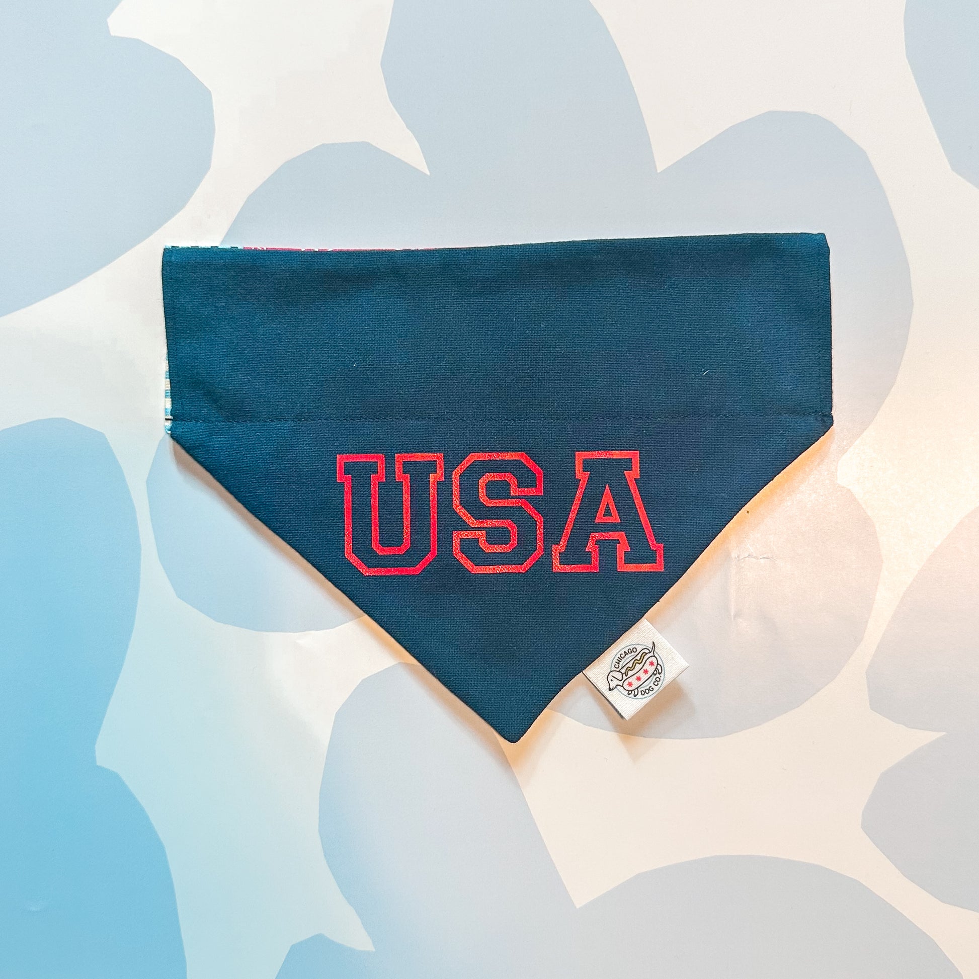 Navy blue bandana with 'USA' in red on a light background