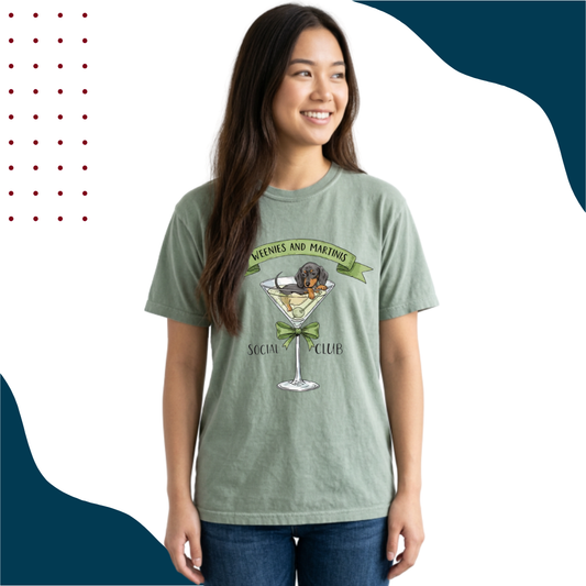 Woman wearing a green t-shirt with a wiener dog in a martini glass