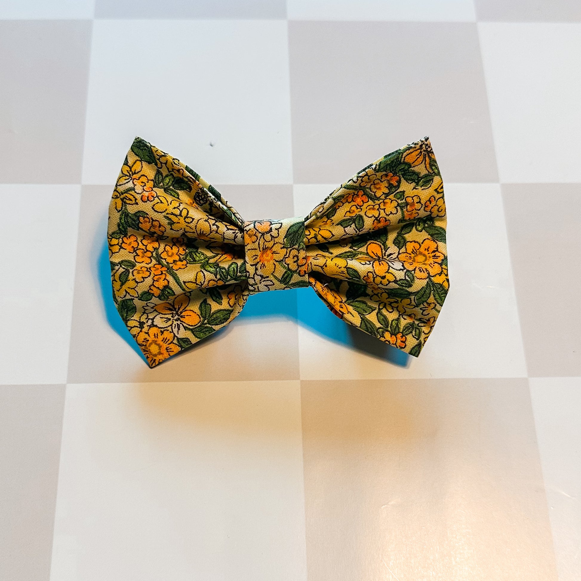 Floral patterned bow tie on a checkered background