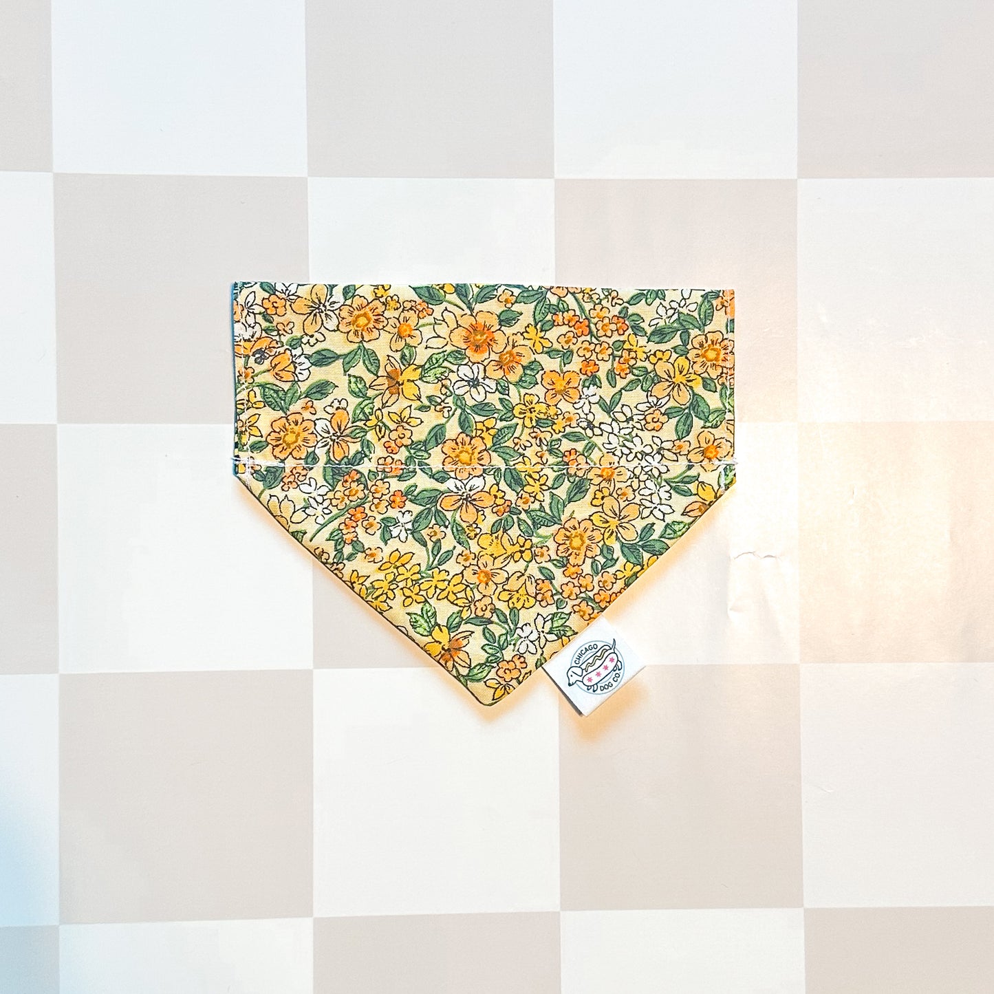 Floral patterned bandana on a checkered background