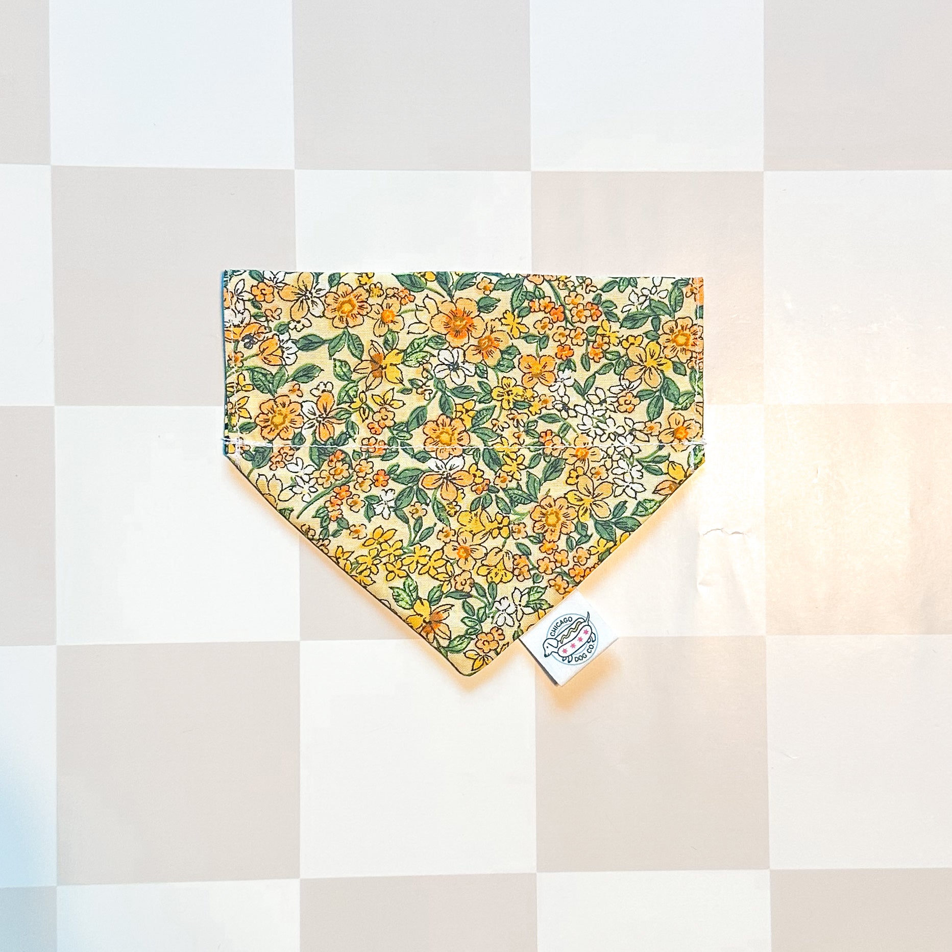 Floral patterned bandana on a checkered background