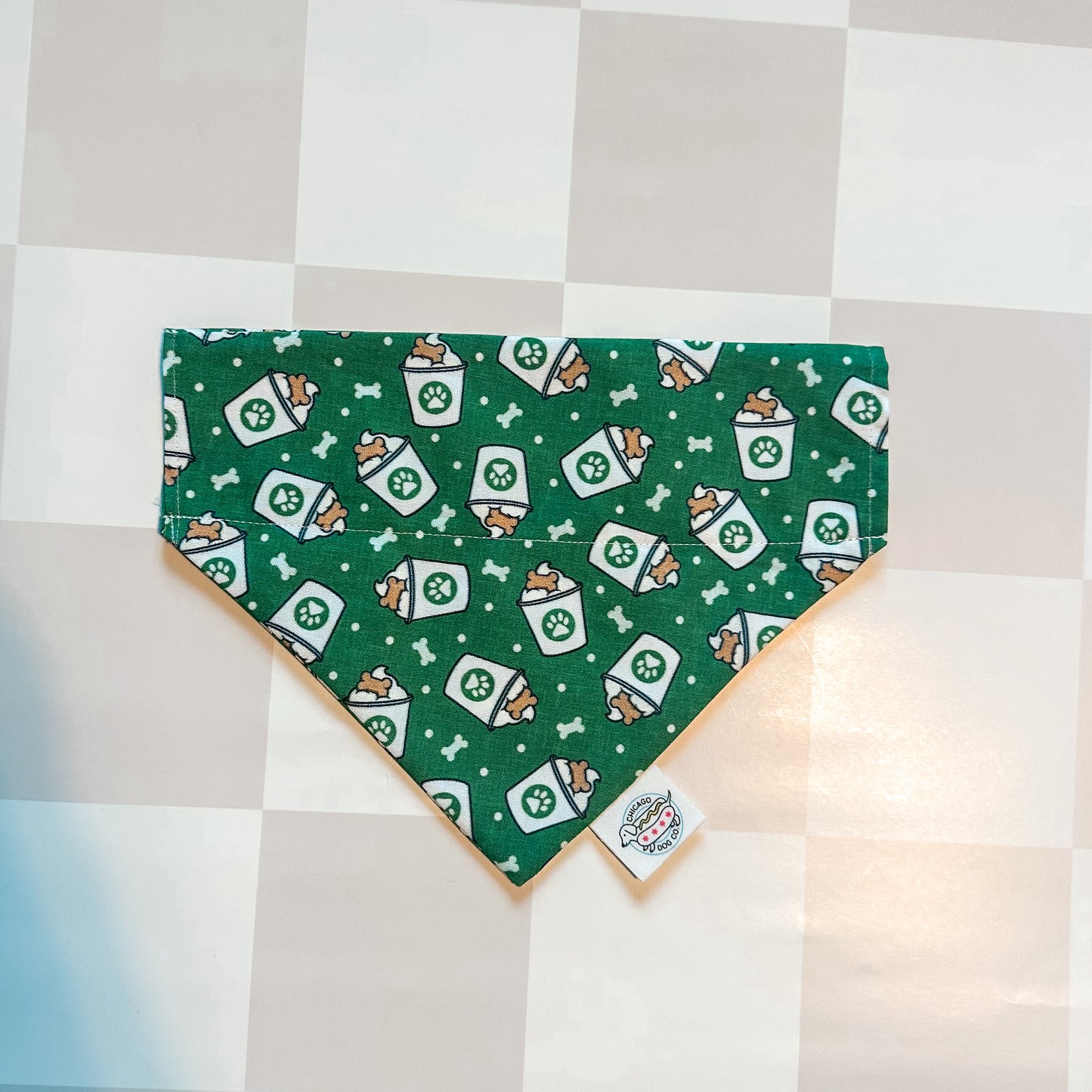 green bandana with pup cups on it 